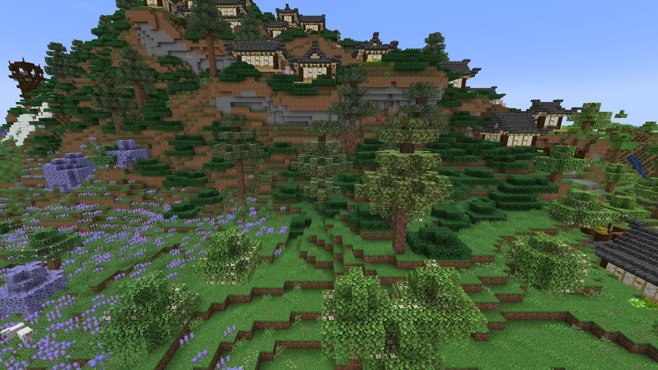A hillside village tucked into the forest.